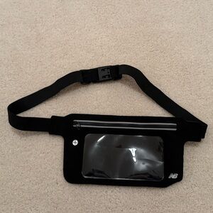 New Balance workout fanny pack. Has buckle to go around waist! Never used!